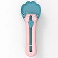 Green and pink pet feed spoon with silicone barrel for squeezing out sticky dog or cat food.