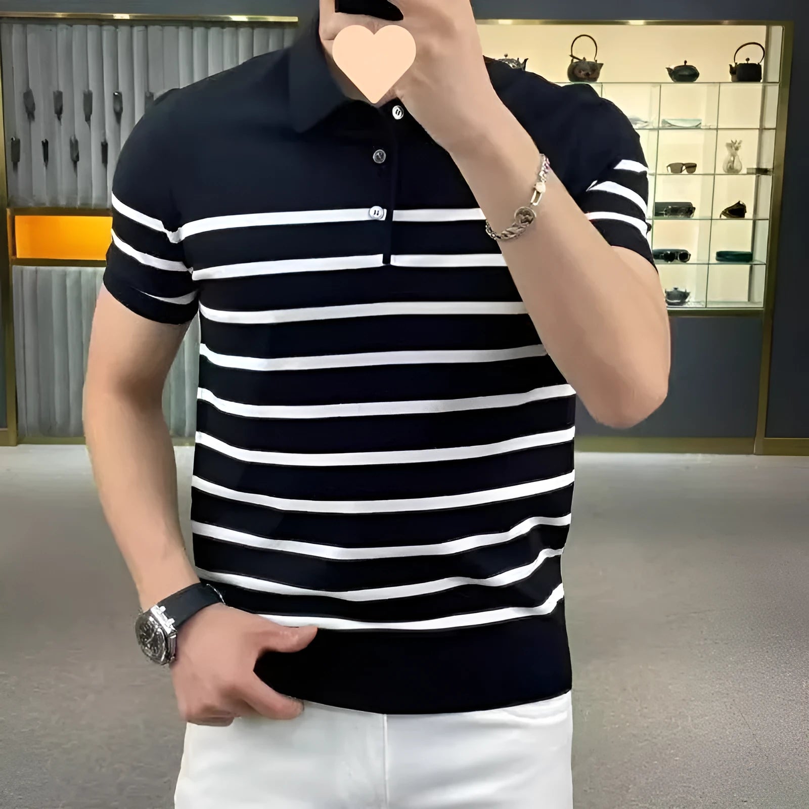 Black and white striped knitted t-shirt with a lapel neckline, shown in a pullover style.