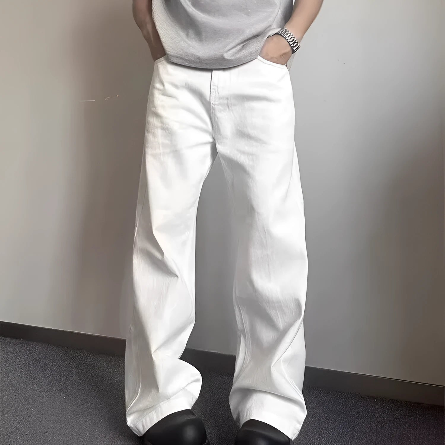 Men's white straight-leg denim jeans with loose wide-leg cut and mid-waist design