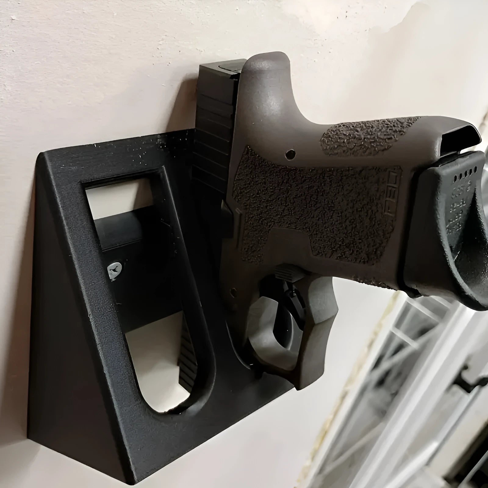 Black plastic punk-style pistol display stand for airsoft guns