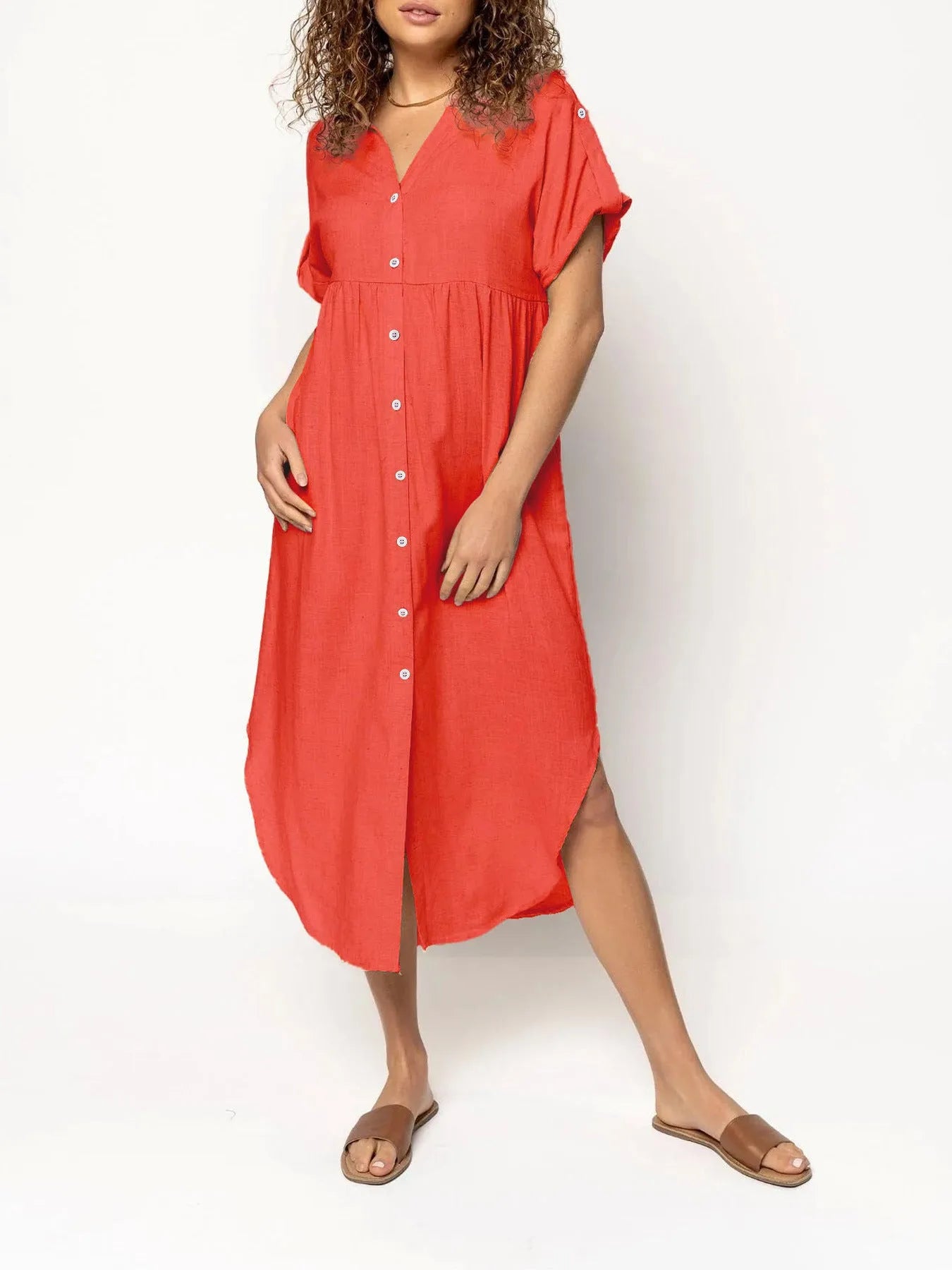 A mid-length casual dress with button detail on the front, shown in a solid colour.