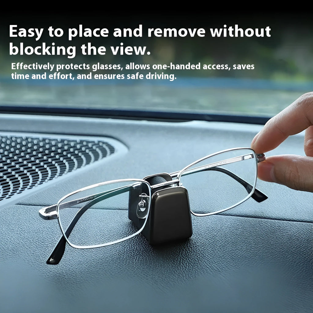 Green zinc alloy and leather glasses clip holder mounted on a car dashboard.