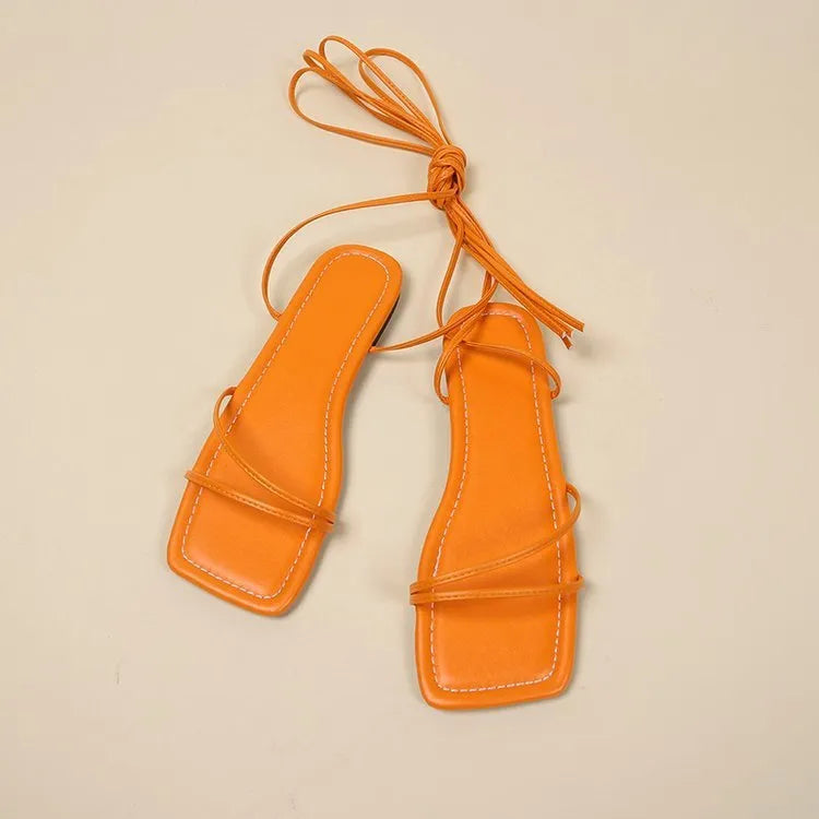 Women's flat sandals with ankle ring bandage cloth detail and front lace-up fastening in solid colour