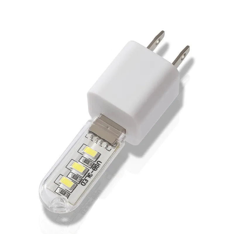 Small white LED baby night light with USB cable, measuring 6cm by 1.8cm