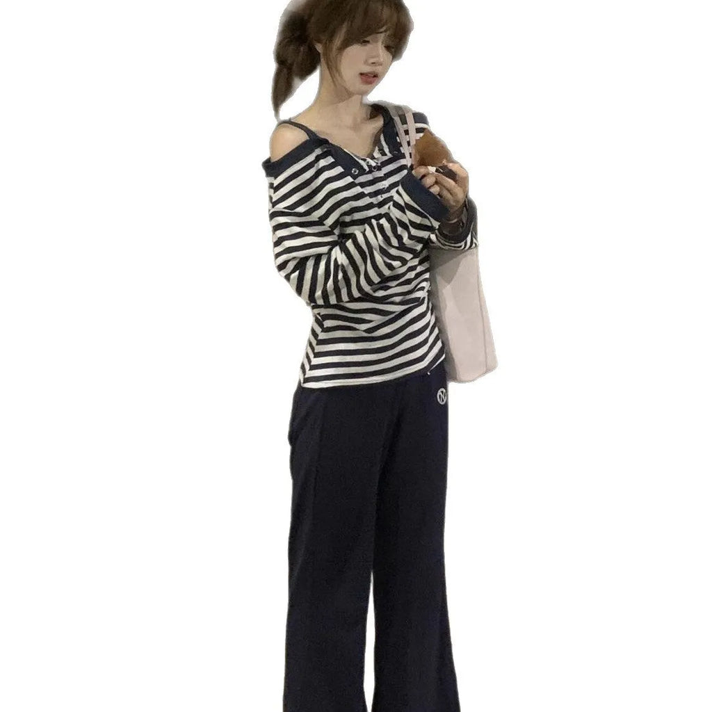 Dark blue Korean-style oversized women's t-shirt with embroidery and stripe details on long sleeves