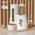 Blue hamster automatic water bottle and dual-compartment white food basin attached together.