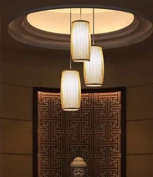 Natural bamboo plait decoration lamp with woven shade, shown with dimensions 15cm wide by 35cm tall.