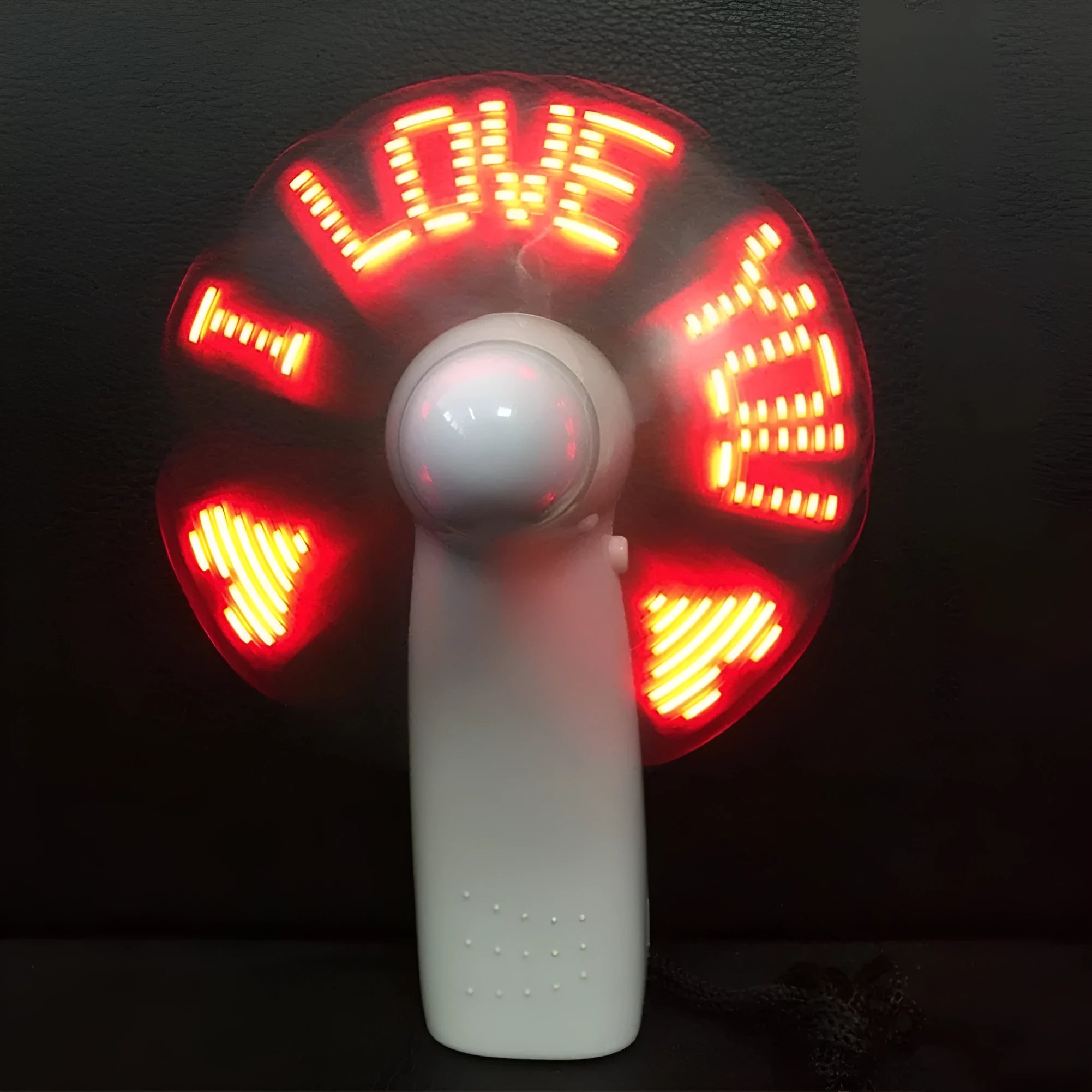 White handheld fan with LED flashing I love you pattern in blue and red colours