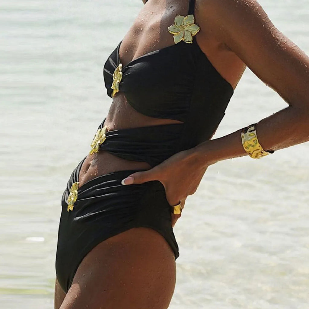 A solid colour one-piece swimsuit for women with a hollow-out tube top and a matching short skirt.