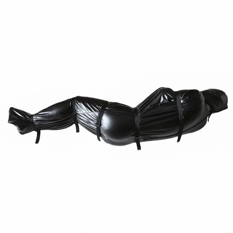 Black patent leather bondage kit showing body wrap garment and six ratchet tie-down straps