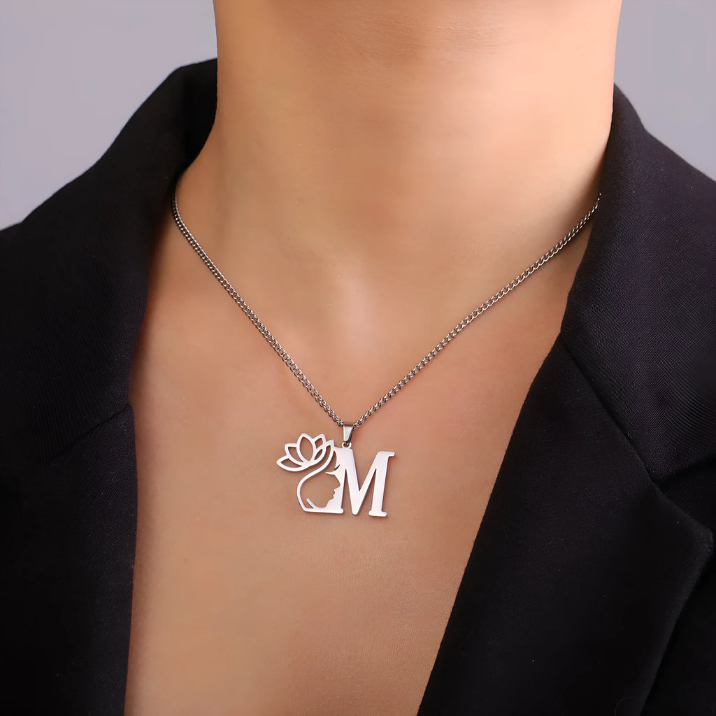Stainless steel necklace with a single alphabet letter pendant on a cross chain, in gold or silver colour.