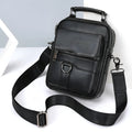 Black genuine first layer cowhide leather messenger bag measuring 19x8x24cm with slung strap