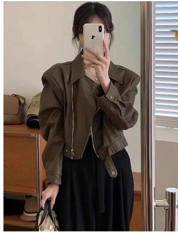Women's brown retro imitation leather jacket with long sleeves, pockets, and a slim fit.