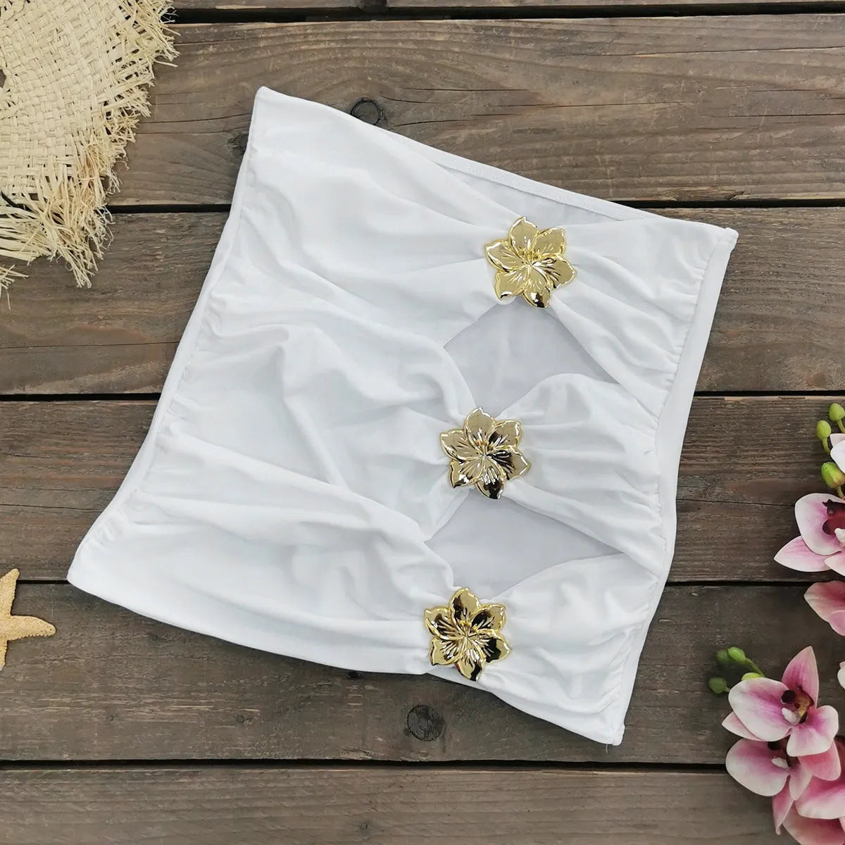 A solid colour one-piece swimsuit for women with a hollow-out tube top and a matching short skirt.