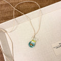Women's necklace with coloured glaze skirt joker pendant on cotton linen clavicle chain