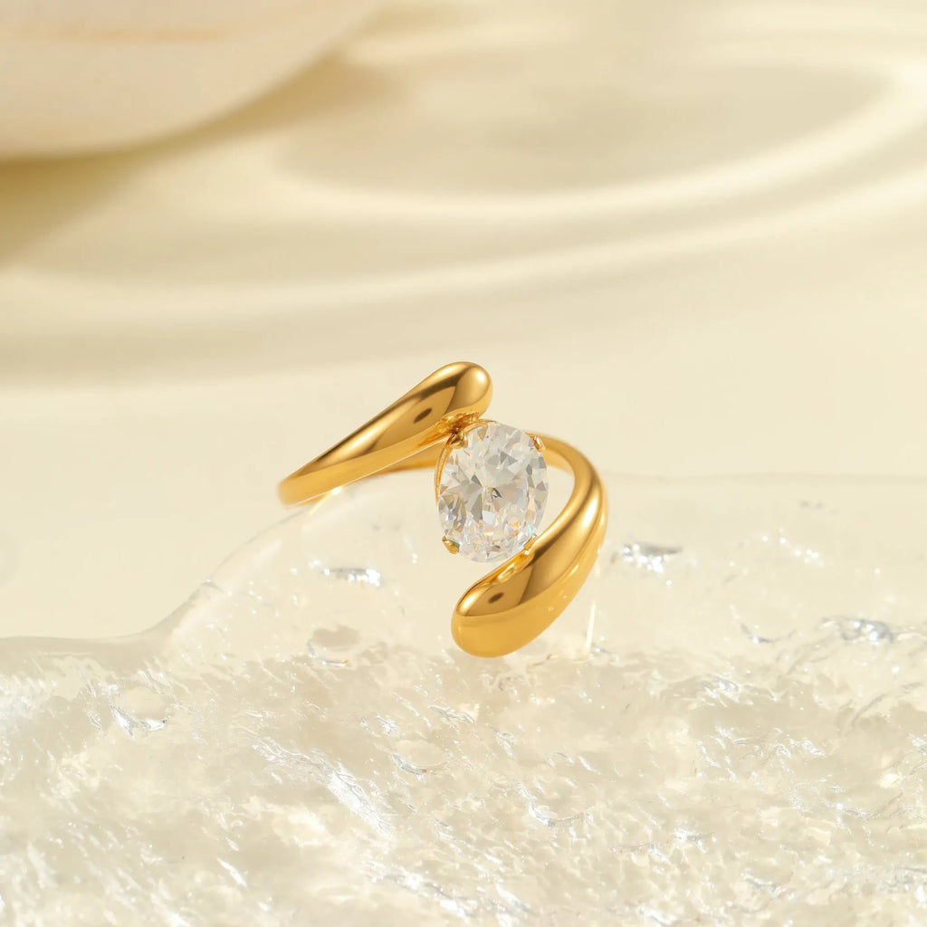 Women's geometric zircon ring with adjustable open mouth design on a hand.