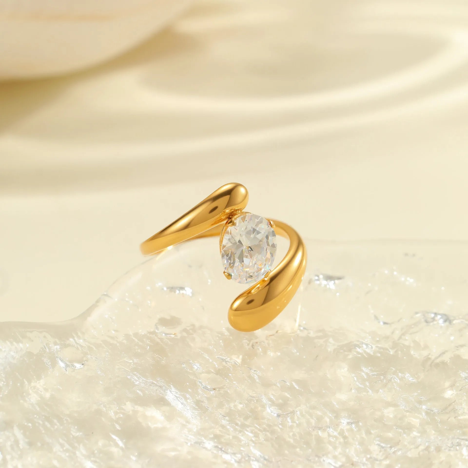 Women's geometric zircon ring with adjustable open mouth design on a hand.