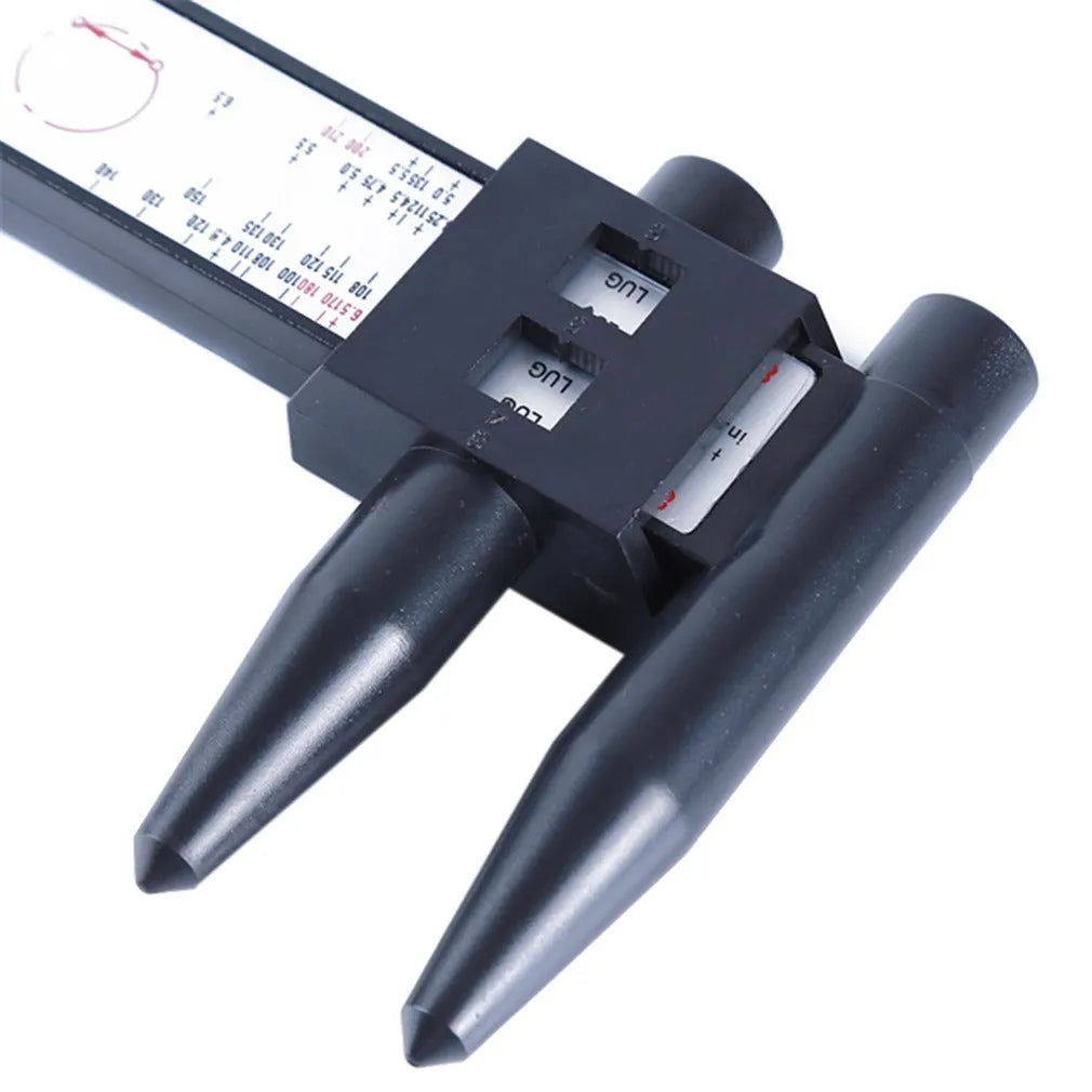 Electronic digital caliper hole distance measuring tool on a workshop bench