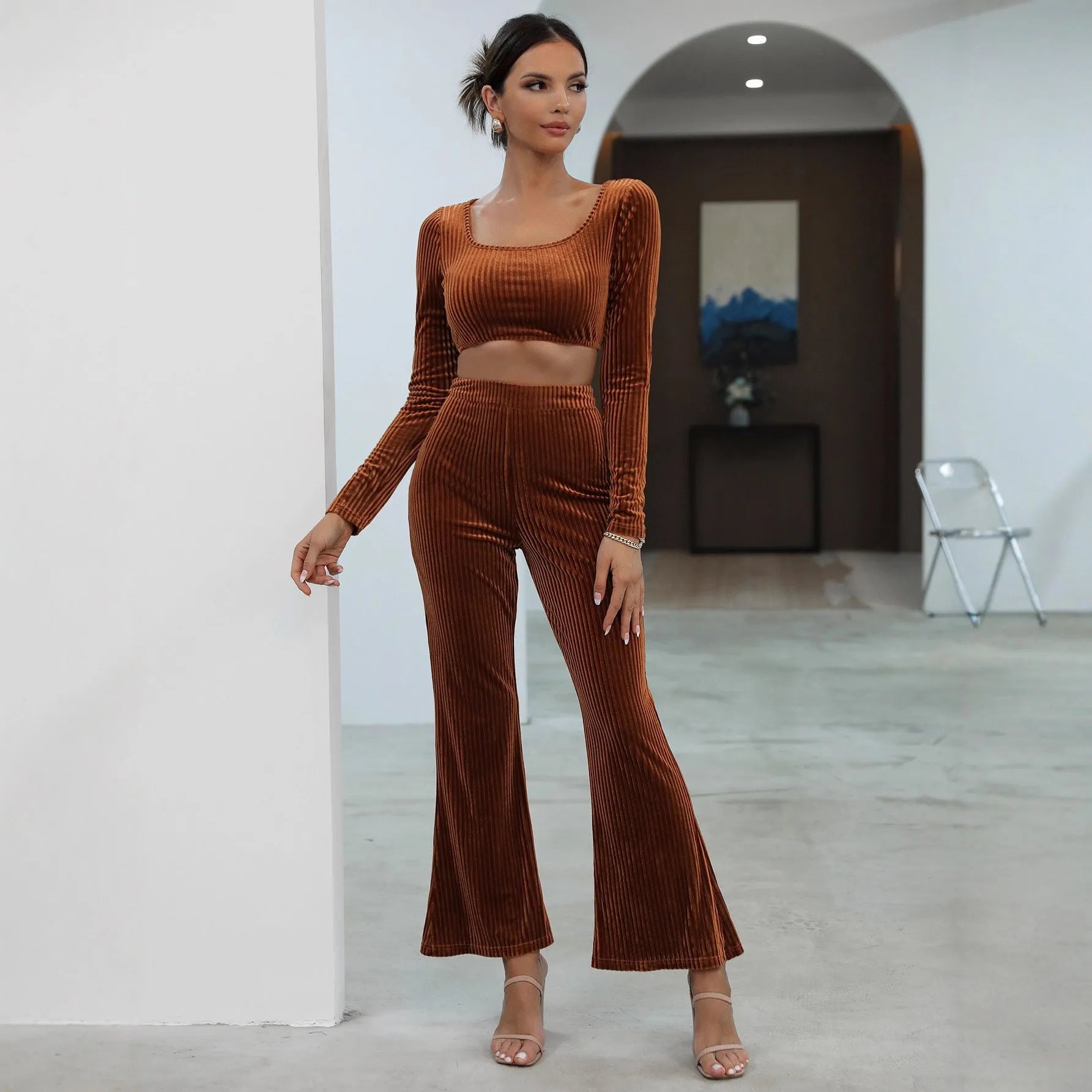 Caramel-coloured long sleeve sweater and trouser set on hanger