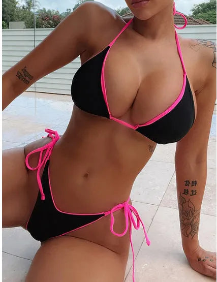 Women's lace-up front triangle bikini and split bottom in a colour style, laid flat.