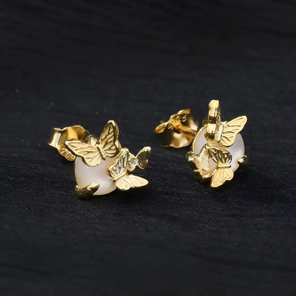 A pair of silver 925 butterfly stud earrings with an animal zodiac design in a gold colour finish.