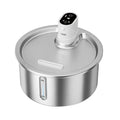 Black and white heated pet water fountain with stainless steel basin on a temperature control base.