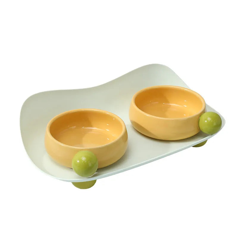 Ceramic double-raised cat bowl set in pink, yellow, or pink yellow with non-slip base