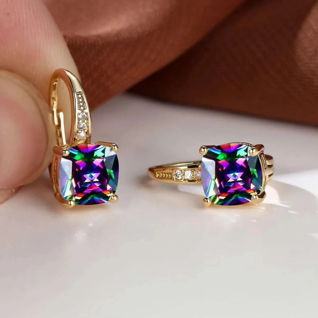 Geometric square copper ear clip earrings with moissanite inlays in a gold electroplated finish.