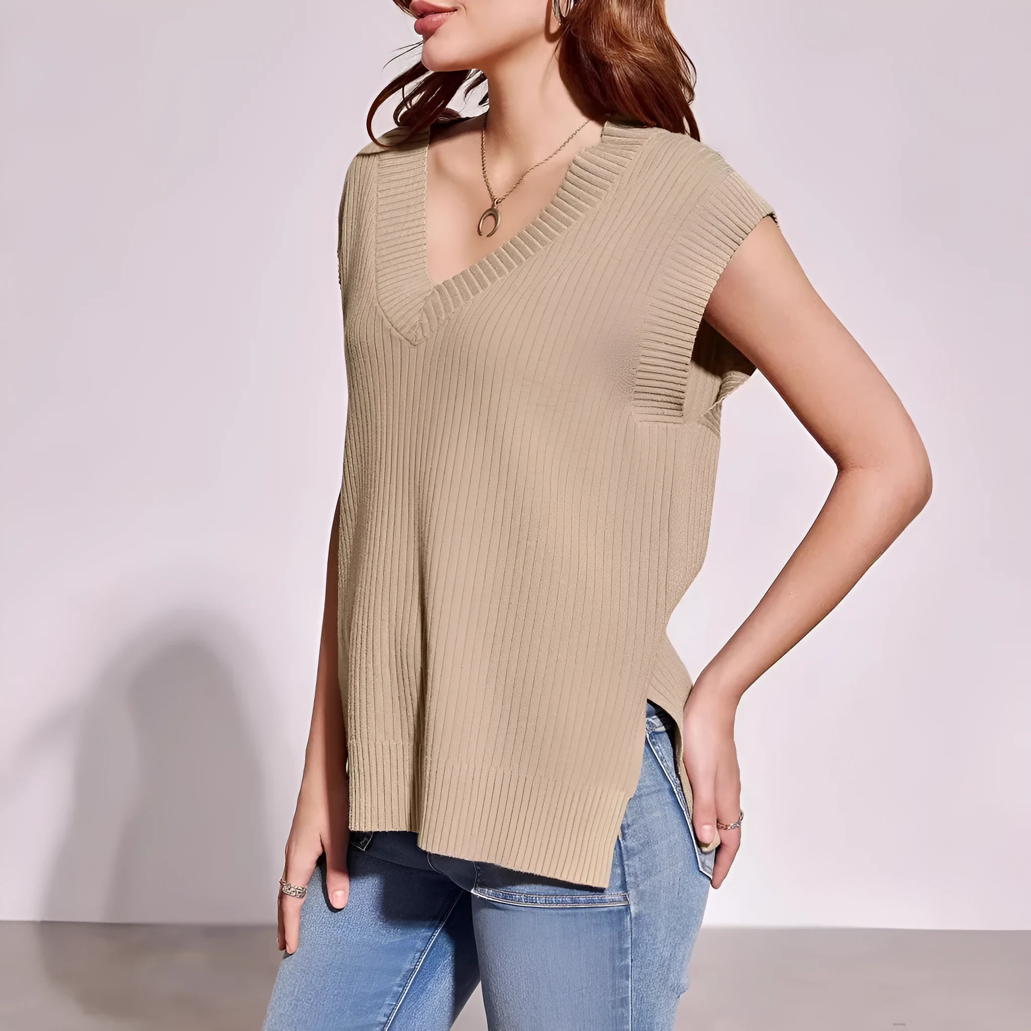 Camel coloured V-neck sleeveless pullover vest with striped pattern and loose fit