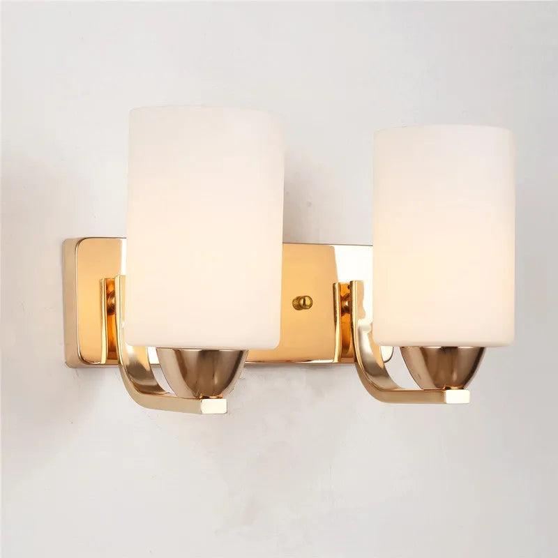 Modern chrome wall lamp with glass lampshade in single head configuration on white wall