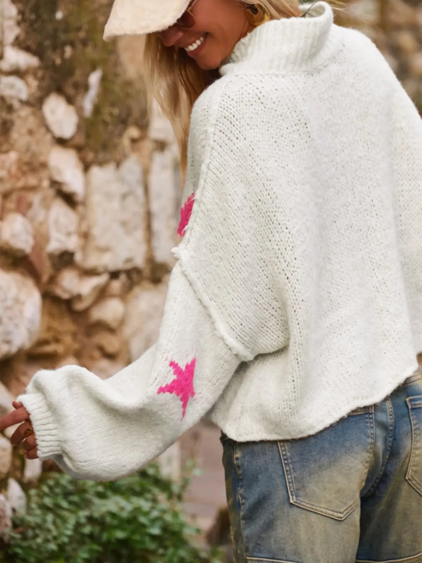 White women's turtleneck pullover with five-pointed star pattern and loose fit design