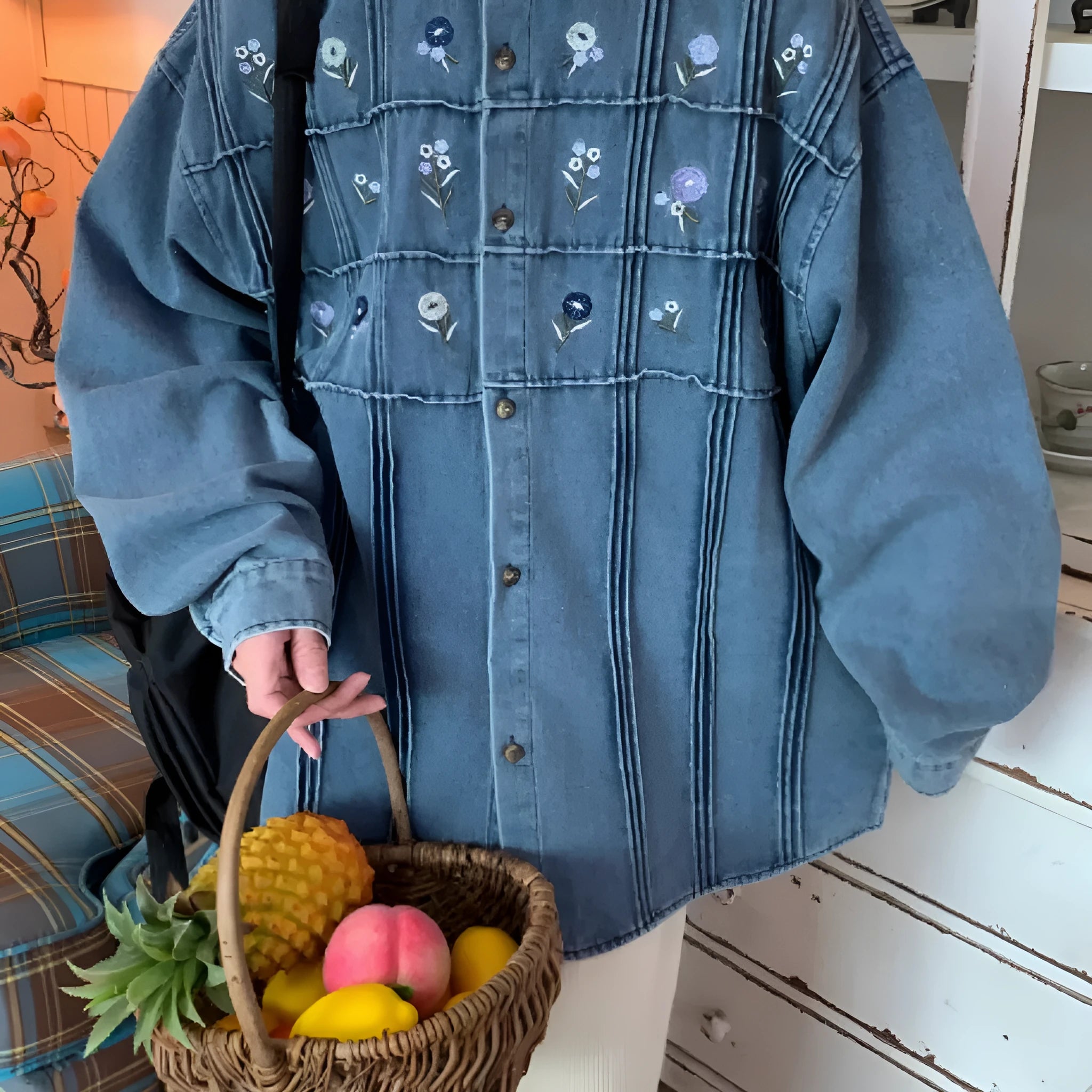 Vintage washed blue denim long sleeve shirt with small floral print and pleated details.