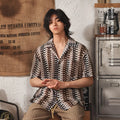 Grey Japanese-style men's shirt with a Cuban collar and textured jacquard pattern, short sleeves.