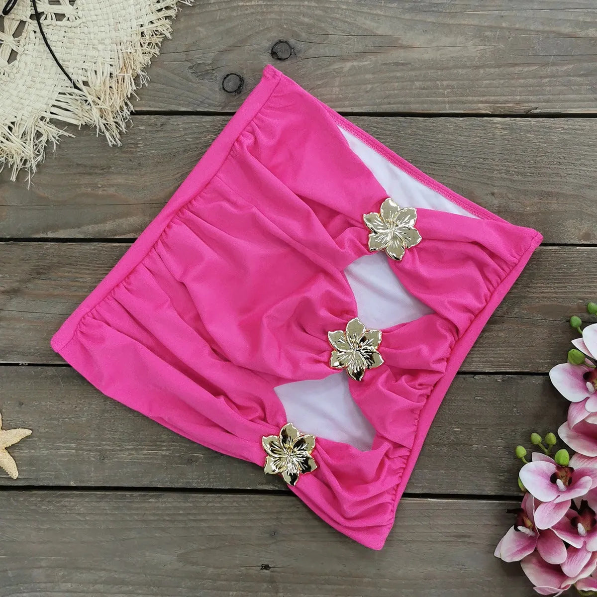 A solid colour one-piece swimsuit for women with a hollow-out tube top and a matching short skirt.