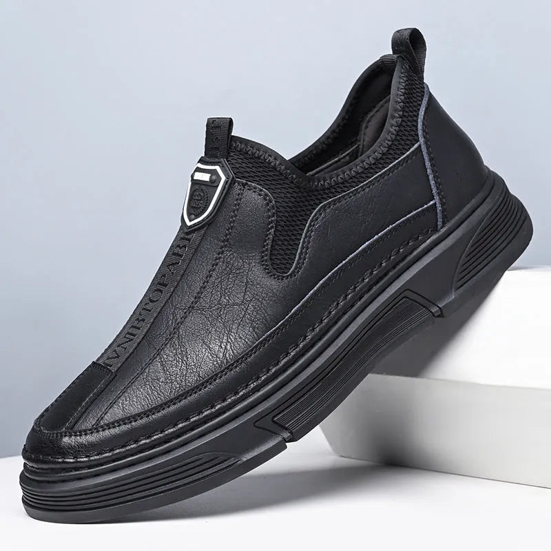 Men's black leather casual shoes with a round toe on a white background.