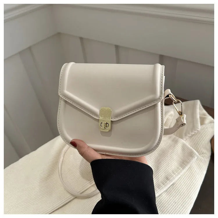 Soft textured PU leather messenger bag with clamshell opening, shown in a horizontal square shape.