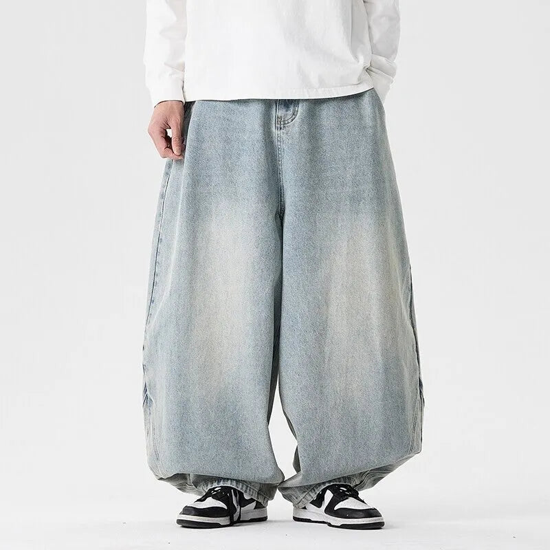 Men's plus size light blue wide leg baggy jeans on a neutral background