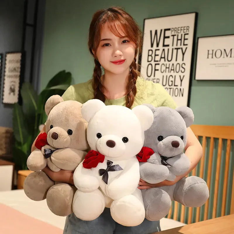 Soft plush Rose Bear teddy bear toy in beige, brown or grey, shown in sizes from 23cm to 45cm.