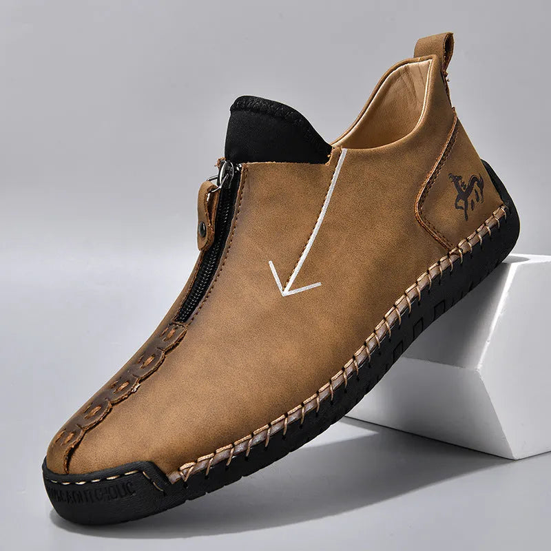Men's black zip-up Martin boot with round toe and low heel on a white background.