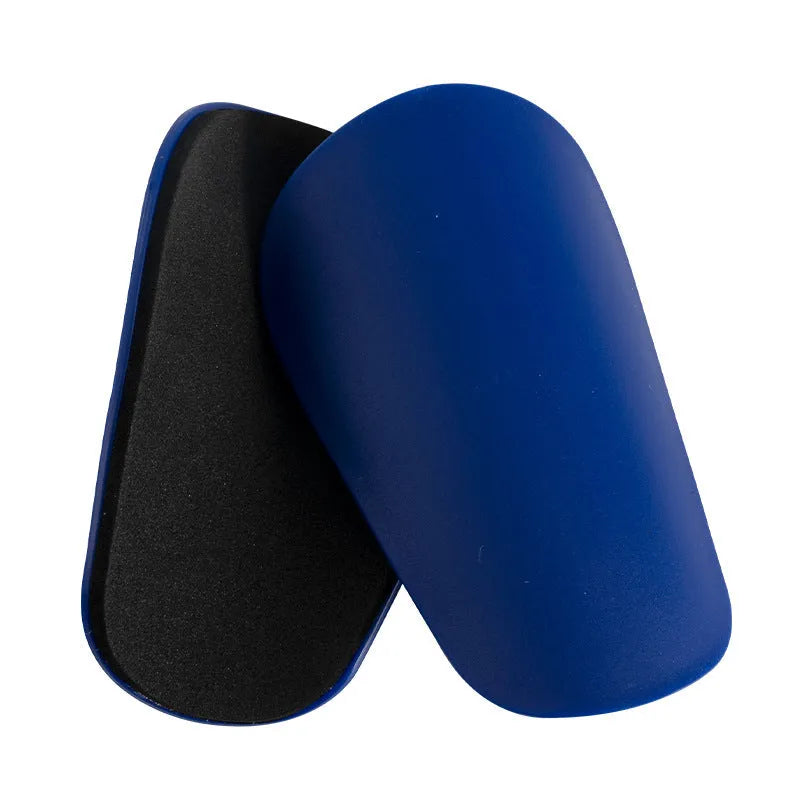 Pair of black PU mini shin guards for sports protection, showing S size.