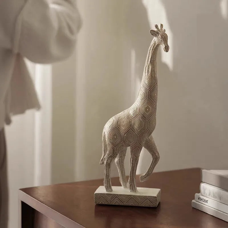 30.5cm tall synthetic resin giraffe ornament in wood colour standing on a shelf