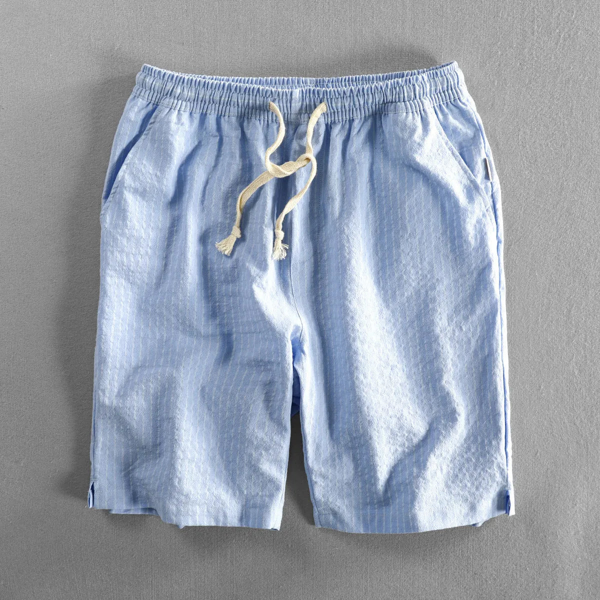 Men's striped casual cotton shorts with an elastic waistband shown in multiple colour options.