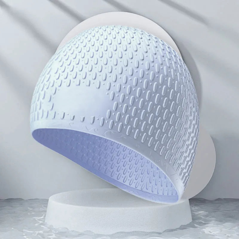 Silicone adult swimming cap with water drop texture in solid colour options on white background.