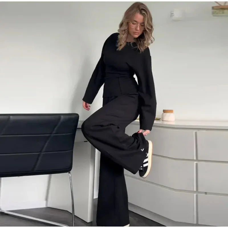 Women's apricot colour polar fleece lounge suit featuring a long sleeve pleated top and wide-leg trousers.