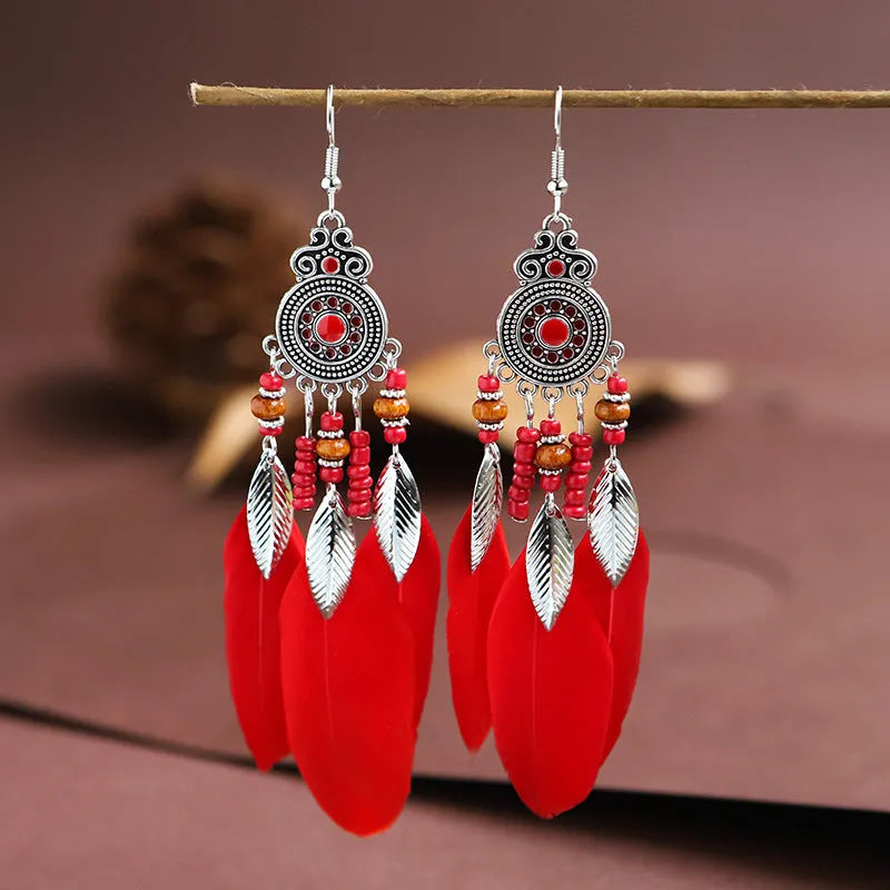 Feather pattern drop earrings with round oil craft design in alloy with electroplated finish