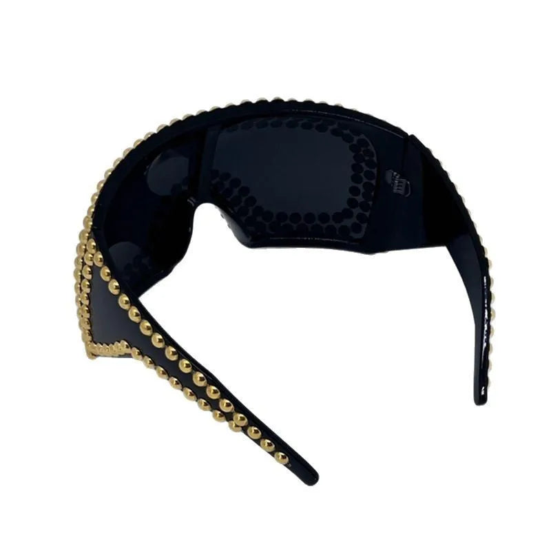 Men's punk-inspired large rim square sunglasses with visible rivet detailing in silver colour