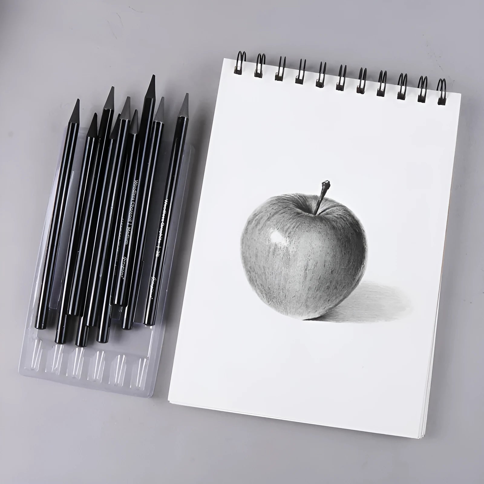 Solid graphite and carbonised drawing pencil set on a suction card pack.