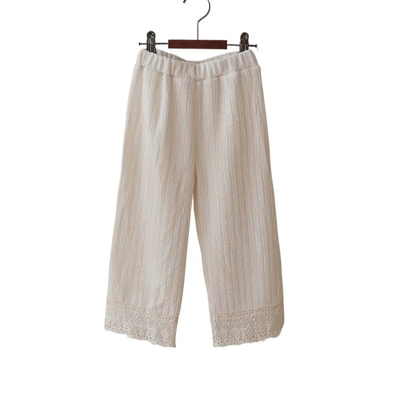Girls loose knitted lace trim straight-leg trousers in pink, apricot, and white colours