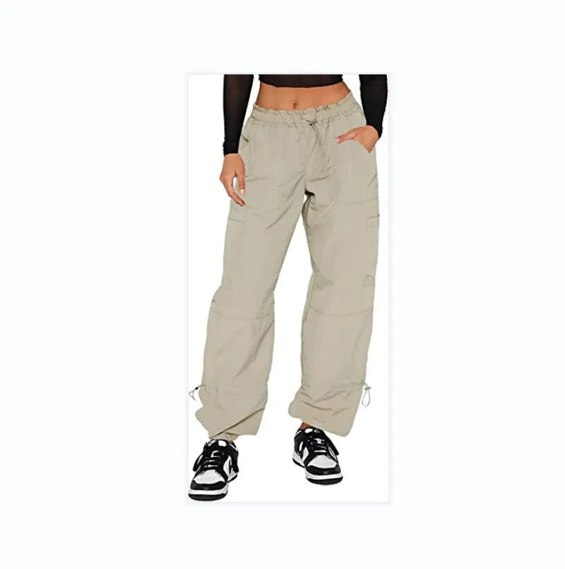 Straight-leg loose fit cargo casual pants in grey with multiple pockets, made from polyester fabric.