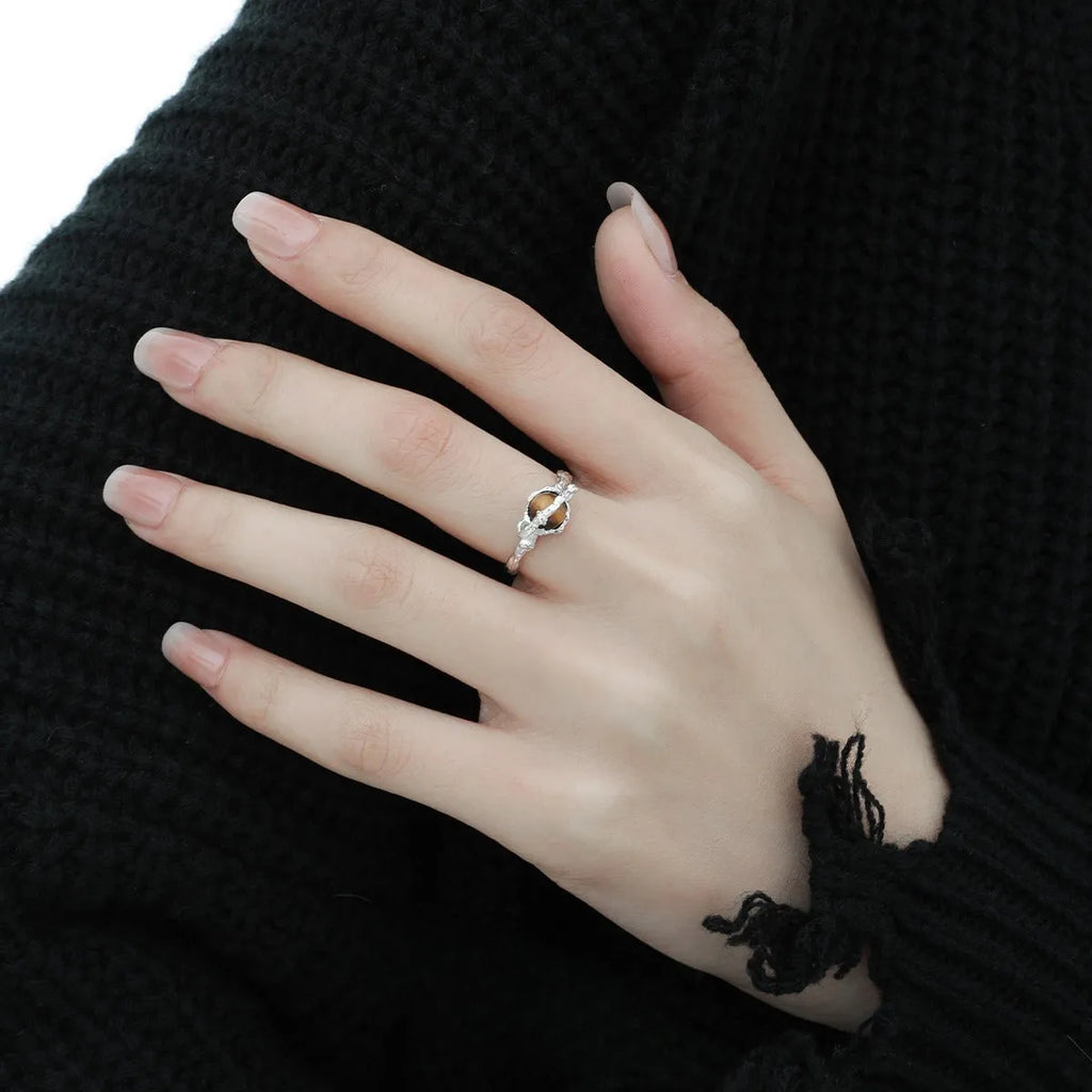 Women's adjustable open ring with Saturn design and tigereye styling in white gold electroplated silver